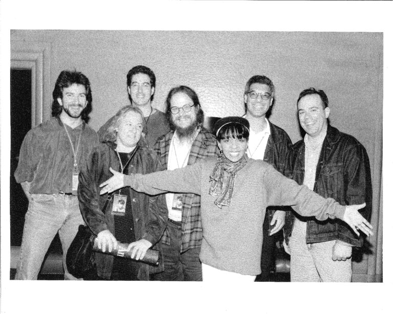 Anita Baker posing with Mark Johnson and the rest of her audio team in 1995